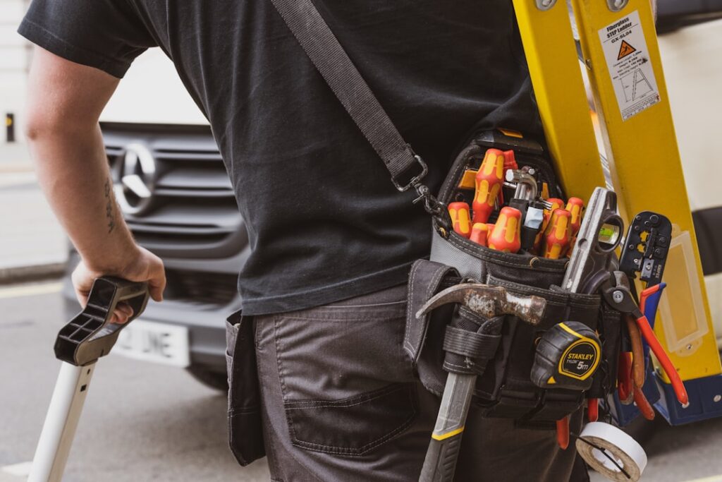 Local tradesman with tool belt representing small service businesses ideal for £300/month SEO budgets